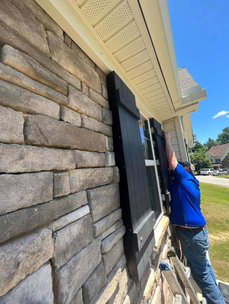 Wildlife technician removing birds from shutters